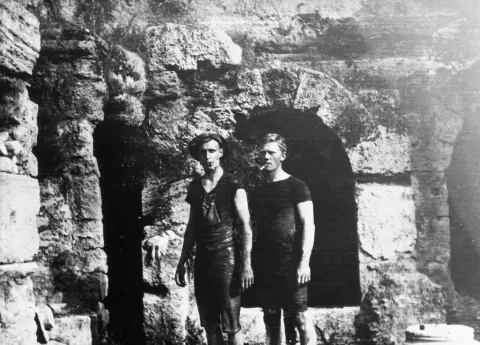 Carl W. Blegen (on the right) with Emerson Swift, both covered in mud after excavating in the tunnels of Peirene (1913-1914)